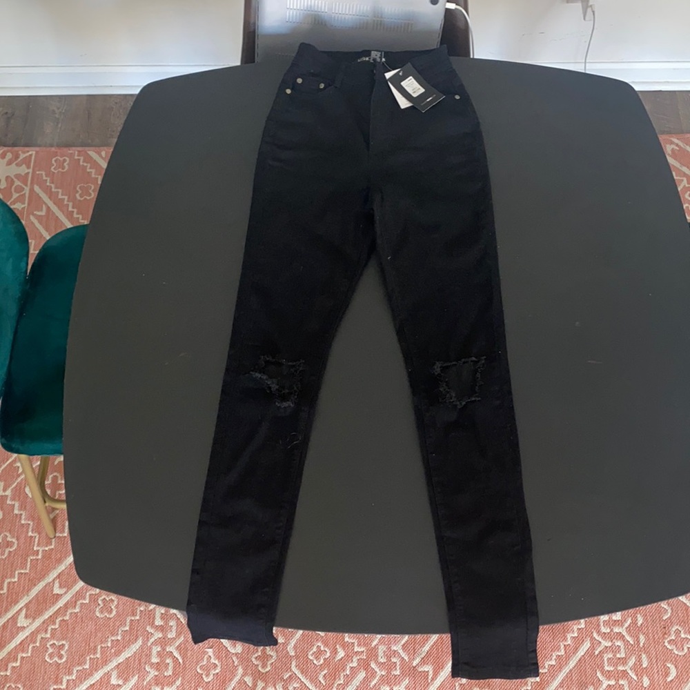 Size 5/6 black jeans with rips in knees